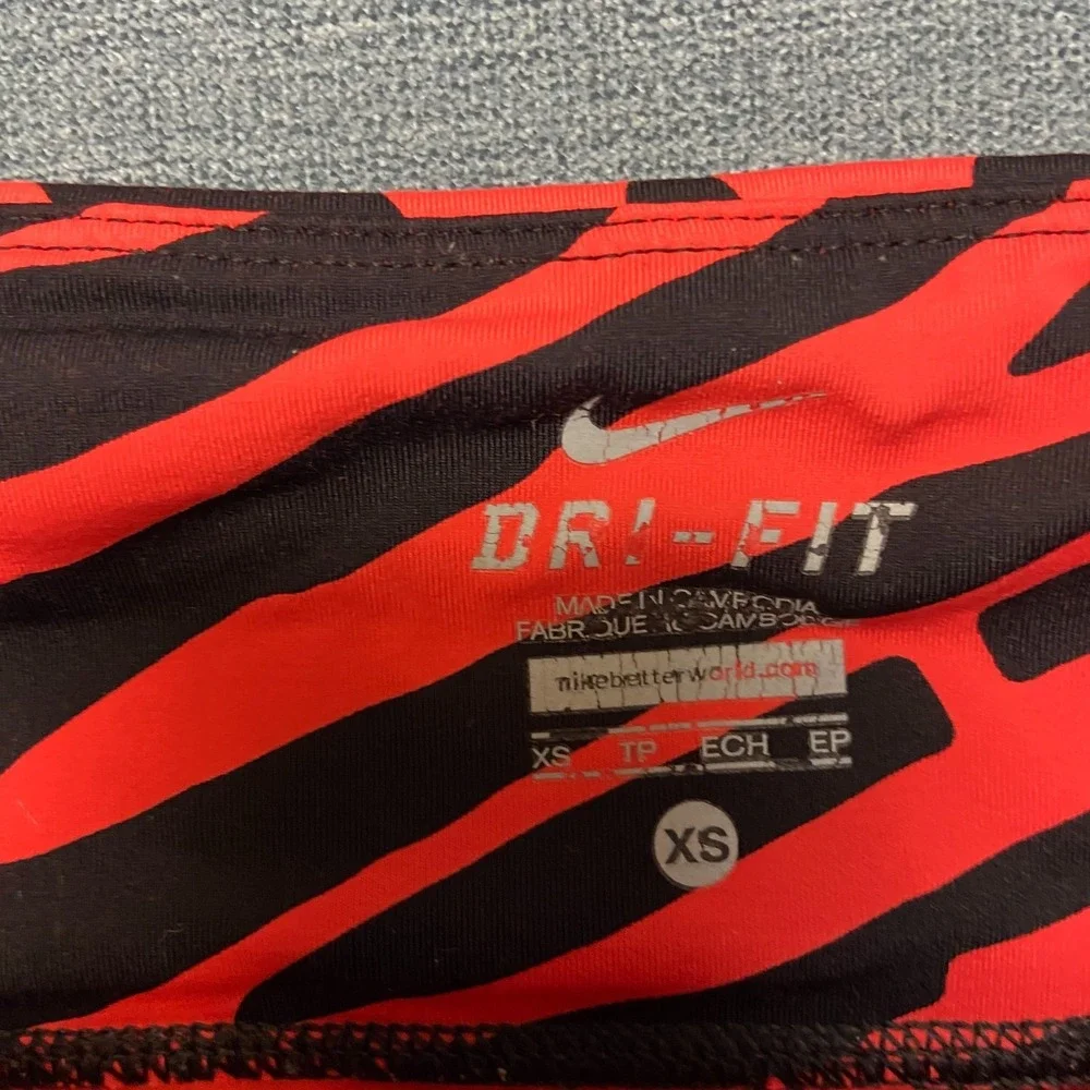 Nike Dri Fit Power Epic Lux Capri Leggings Womens XS Black Orange Abstract Print